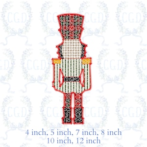 May include: A festive nutcracker design with a red, green, and black patterned hat and legs. The nutcracker's body features vertical green and white stripes, with a tan and white checkered face. The image includes size options: 4, 5, 7, 8, 10, and 12 inches.
