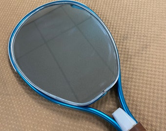 Mirror Squash Racket hanging