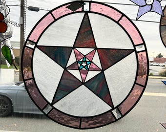 Estrella rosa en círculo rosa