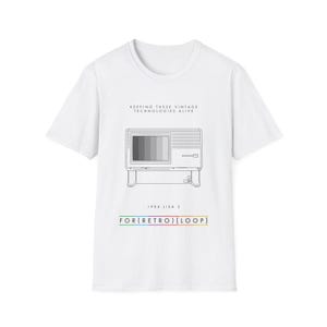 May include: White t-shirt with a black and white illustration of a vintage computer. The text "KEEPING THESE VINTAGE TECHNOLOGIES ALIVE" is above the illustration. The text "1984 LISA 2" is below the illustration. The text "FOR(RETRO)(LOOP)" is below the text "1984 LISA 2".