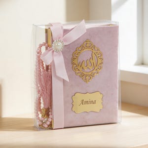 May include: A set of three ceramic mugs with a speckled, cream-coloured glaze. Each mug features a different hand-painted design: a blue and green leaf, a yellow and orange flower, and a red berry sprig. The mugs have a simple, rounded shape.