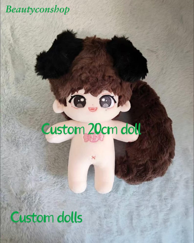 May include: A custom 20cm doll with brown hair and a black dog costume. The doll has a pink candy design on its chest and a brown tail.