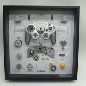 Framed Original Nintendo GameCube (Silver) Controller Exploded View Art - Retro Gaming Wall Decor with Genuine Parts