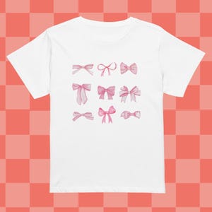 Cute Pink Ribbon Shirt with Bows, Girly Aesthetic Y2K Bow T-shirt, Kawaii Pink Ribbon Top, Feminine Vintage-Inspired Coquette T-Shirt  bows