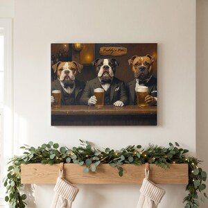 May include: A rectangular wall art print featuring three dogs dressed in formal suits and bow ties, sitting at a bar counter. Each dog holds a glass of beer. A wooden sign above them reads Buddy's Bar. The scene is set in a dimly lit tavern.