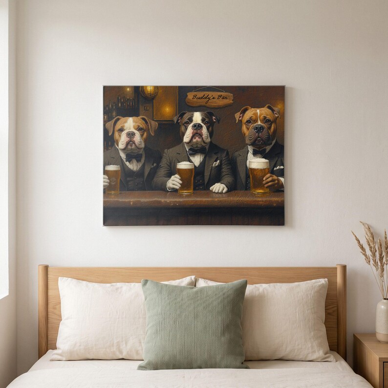 May include: A rectangular wall art print featuring three brown and white bulldogs dressed in dark suits and bow ties, sitting at a wooden bar counter. Each dog holds a glass of golden beer. A wooden sign above them reads Buddy's Bar in dark text.