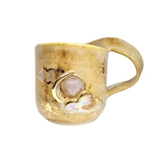 Small Crescent Moon and Clouds Rose Quartz Crystal Mug Handmade Beautiful Gold Sculpted Details Shine Bright Text Warm Oats Caramel Colours