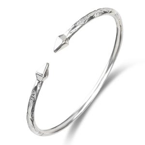 May include: A silver bangle bracelet with a textured design and pointed ends.
