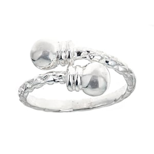 May include: Silver ring with two round beads and a textured band.