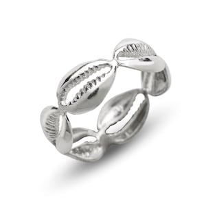 May include: Silver ring with a design of multiple connected seashells.