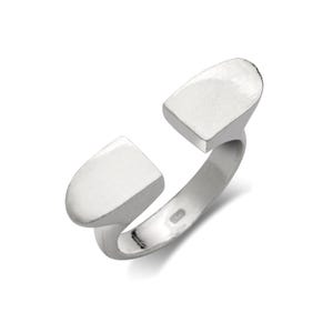 May include: A silver ring with two rectangular shaped pieces that are open on one side. The ring is made of metal and has a smooth finish.