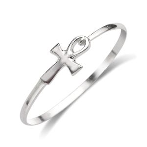 May include: A silver bangle bracelet with an ankh cross charm.