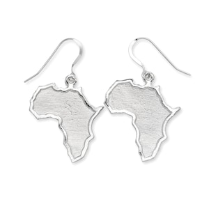 May include: Silver earrings shaped like the continent of Africa. The earrings have a brushed silver finish and are on a hook style earring.