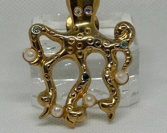 Whimsical gold octopus brooch by Avon, adorned with faux pearls and rhinestones — ocean‑inspired vintage charm.
