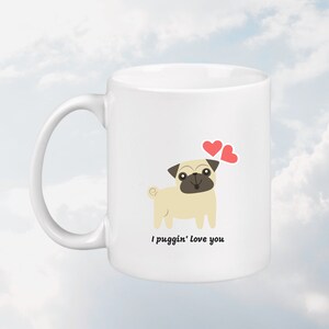 May include: White ceramic mug with a cartoon pug and two red hearts. The text on the mug reads "I puggin' love you."