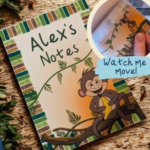 May include: A notebook featuring the text "Alex's Notes" and a cartoon monkey with a banana. The design includes a green and brown border and a vine motif. The image also includes the text "Watch me Move!"