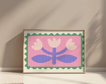 Puede incluir: Una impresión enmarcada de una flor estilizada con tres flores rosas y hojas moradas sobre un fondo rosa. El marco tiene un borde verde y blanco.