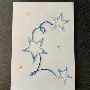 Tarjeta con bordado de estrella fugaz