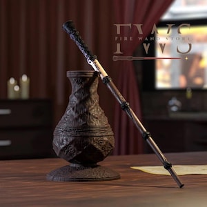May include: A dark brown magic wand with intricate carvings and black accents, resting beside a matching vase. The wand features a detailed handle and a light-colored central section. The image includes the text "FIRE WAND STORE" and a logo.