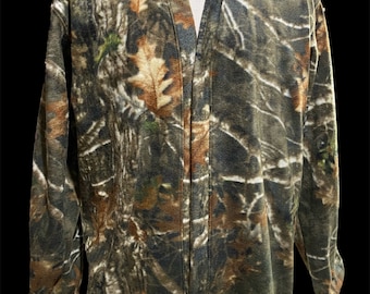 May include: Camouflage fleece jacket with a zipper closure and the text "Eagle Wear Int'l" on the top left corner.