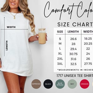 May include: A white unisex tee shirt with a size chart showing length and width measurements in inches. The shirt is available in multiple colors, including espresso, black, blue spruce, bay, crimson, and ivory. The text "Comfort Colors" is at the top.