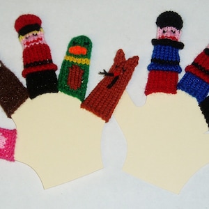 May include: A set of eight knitted finger puppets, including a red and black soldier, a brown bear, a pink bird, a green duck, a brown squirrel, a red and blue policeman, a blue and red sailor, and a black and white man.