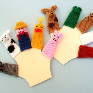 May include: A set of ten finger puppets featuring various farm animals, including a pig, cow, rooster, chicken, and dog. The puppets are made of knitted yarn in a variety of colors, including pink, white, red, brown, and yellow.