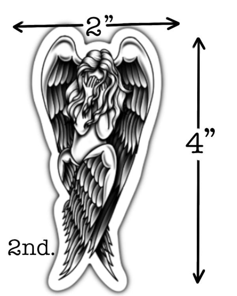 May include: A black and white sticker featuring an angel with outstretched wings, covering her face. The sticker is 4 inches (10 cm) tall and 2 inches (5 cm) wide. The word "2nd." is printed at the bottom.