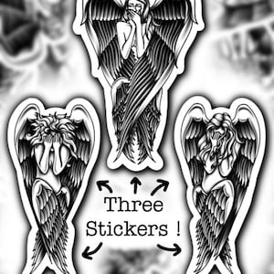 May include: Three black and white stickers featuring angel figures with large feathered wings. The angels are depicted in various poses, with one covering their mouth and another covering their eyes. The text "Three Stickers!" is included.