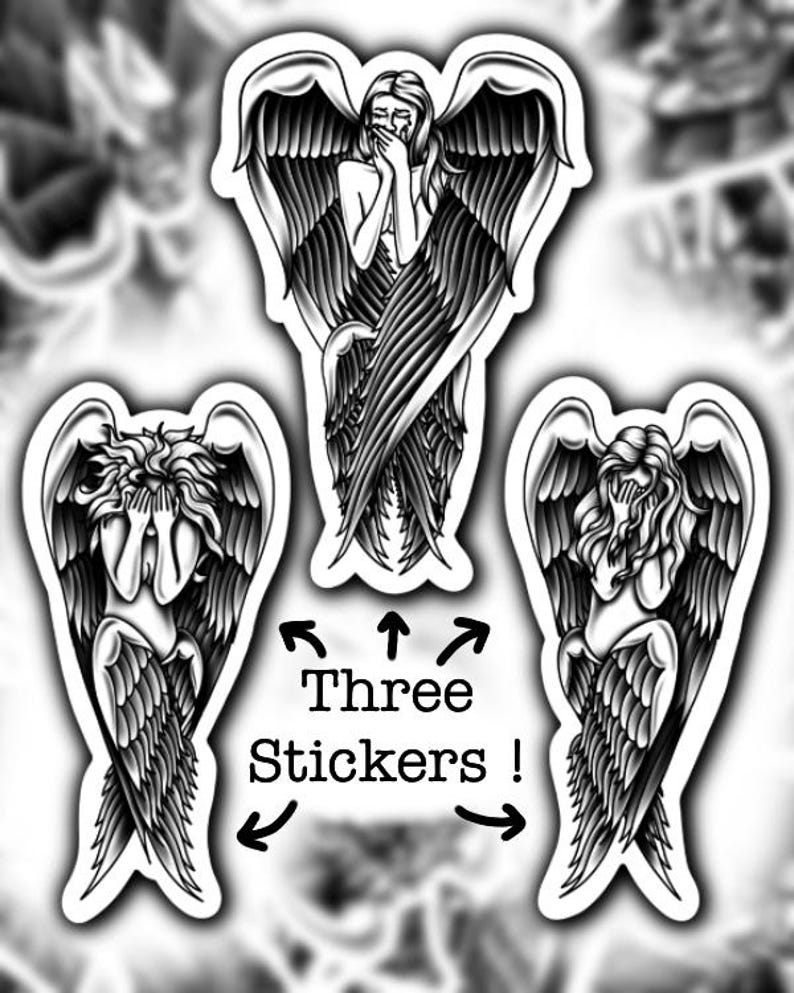May include: Three black and white stickers featuring angel figures with large feathered wings. The angels are depicted in various poses, with one covering their mouth and another covering their eyes. The text "Three Stickers!" is included.