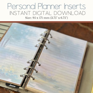 May include: Open personal planner with lined pages and a watercolour design. The planner is open to a page with a soft blue and white landscape design. The text "Personal Planner Inserts" and "Instant Digital Download" are at the top. The size is 9.5 cm x 17.1 cm.