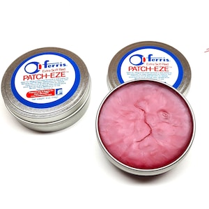 May include: Two silver tins of red Extra Soft Red PATCH-EZE, a product for patching and sealing, with one tin open showing the red, pink, and white paste inside.