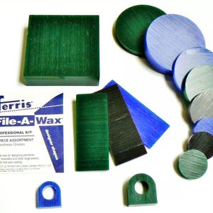 May include: An assortment of green, blue, and gray wax shapes for jewelry design. Includes a square, rectangles, circles, and a kit labeled "Ferris File-A-Wax PROFESSIONAL KIT". The kit contains 14 pieces in 3 hardness grades, perfect for lost wax casting.