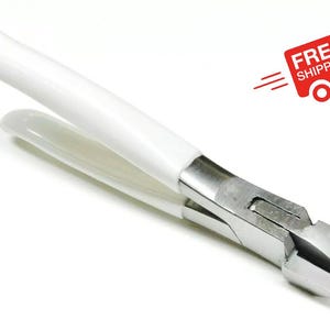 May include: White handled pliers with a silver metal jaw. The pliers are designed for bending and shaping metal.
