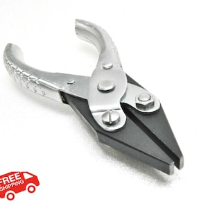 May include: A silver and black automotive tool, likely pliers, with a curved handle and a pointed, angled head. The tool has a series of numbers etched on the handle. The tool is on a white background.