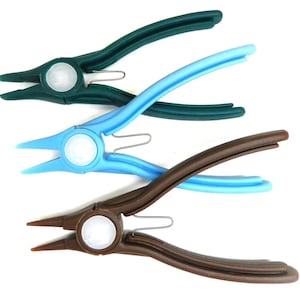 May include: Three pairs of jewelry pliers in green, blue, and brown. Each plier has a rounded handle and a pointed tip. The pliers are made of plastic and have a metal spring.