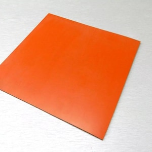 May include: A bright orange square sheet of craft paper.