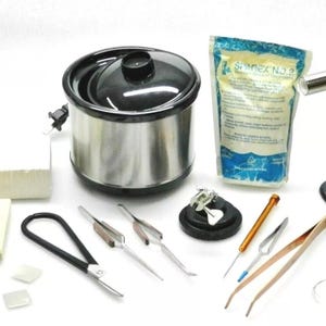 May include: A jewelry making kit with a slow cooker, a torch, tweezers, a small container of flux, a bag of solder, and other tools.