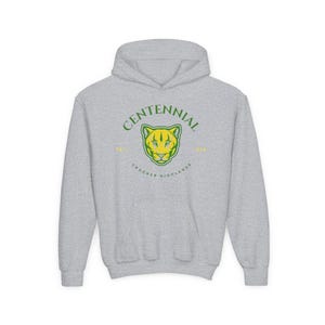 May include: A grey hoodie with a front graphic. The graphic features a cougar head in yellow and green, with the word "CENTENNIAL" above and "CROCKER HIGHLANDS" below. The hoodie has a drawstring hood and a front pocket.