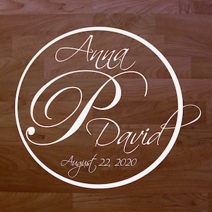 May include: White circle with the names Anna and David and the date August 22, 2020.