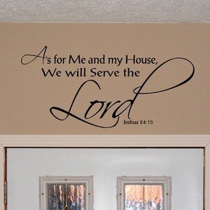 May include: A black and white wall decal with the text "A's for Me and my House, We will Serve the Lord Joshua 24:15". The decal is placed above a white door with a glass window.