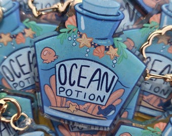 Ocean Potion 2.5 Inch Glitter Epoxy Keychain Charm with whales jellyfish and starfish designs