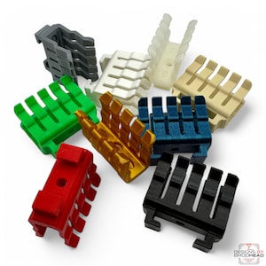 May include: Assortment of 3D printed cable clips in various colors, including red, green, white, black, gray, beige, gold, and blue. The clips are designed to hold cables in place and are made of a durable plastic.