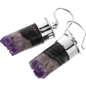 May include: Silver dangle earrings with a purple amethyst crystal encased in a silver setting. The amethyst is a natural crystal with a rough, irregular shape.