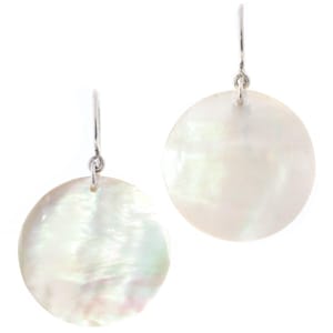 May include: A pair of silver dangle earrings with large, round, white mother-of-pearl discs.
