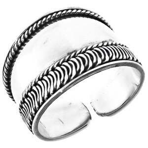 May include: A silver adjustable ring with a wide band featuring a braided design. The band is smooth and polished.
