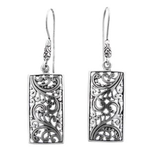 May include: Silver dangle earrings with a rectangular filigree design. The earrings have a delicate, intricate pattern of swirls and loops.