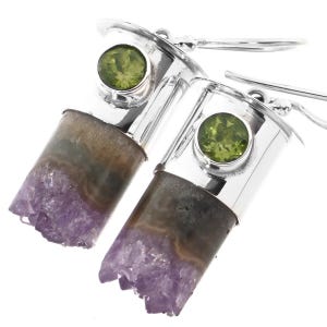 May include: Silver earrings with amethyst and peridot gemstones. The amethyst is a cluster of crystals and the peridot is a round cabochon.