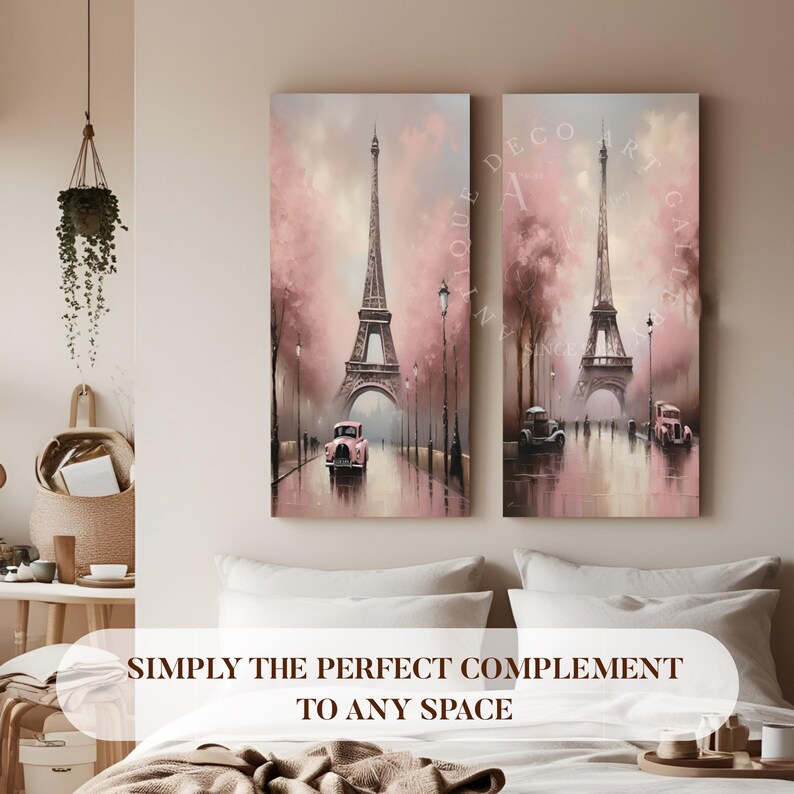 May include: A set of two pink and gray canvas paintings featuring the Eiffel Tower in Paris, France. The paintings depict a Parisian street scene with trees, streetlights, and cars. The text "Antique Decor Art Gallery" is visible in the upper right corner of the image.