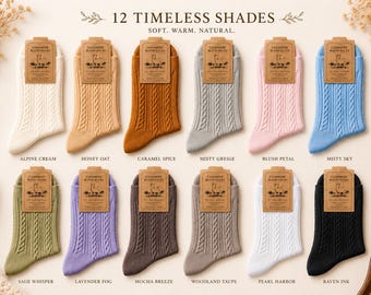 May include: Twelve pairs of cable-knit cashmere blend socks arranged in two rows. Colors include cream, honey, caramel, gray, pink, blue, sage, lavender, mocha, taupe, white, and black. Each pair features a brown paper label reading Cashmere Blend Socks.